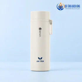 Bình Elmich màu kem với biểu tượng lá và tên AN TÂM nhỏ dưới dấu hãng.