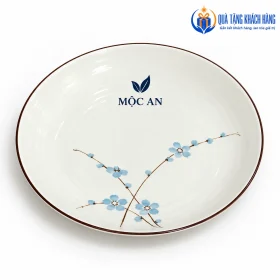 Mô phỏng logo MỘC AN trên đĩa men kem hoa xanh
