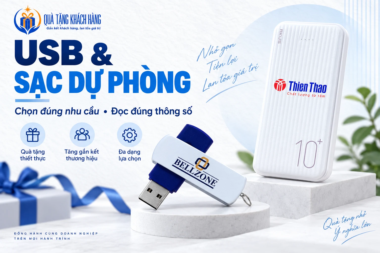 Banner USB và sạc dự phòng, USB vỏ xoay xanh và pin sạc trắng có logo.